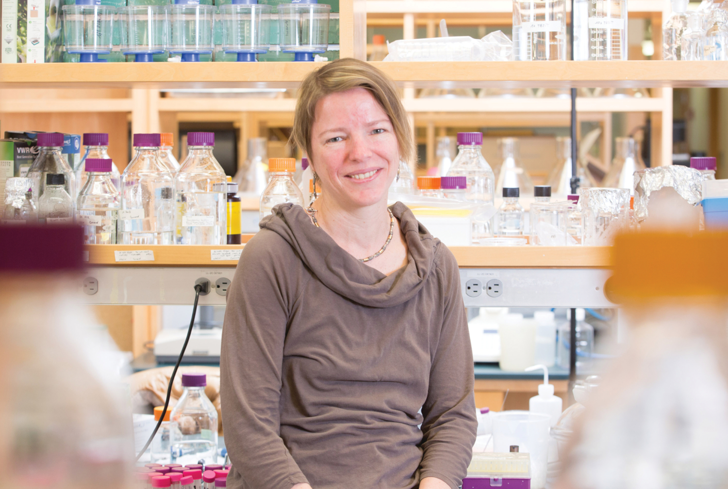 Photo of a woman standing in a laboratory