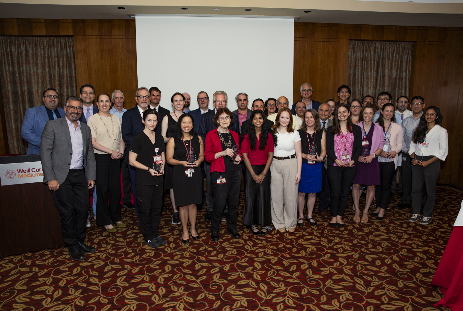 A group of people pose for a photo