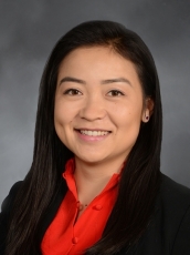 a woman smiling for a portrait