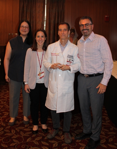 Group of people posing for a photo at a reception
