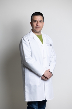 a man in a white coat