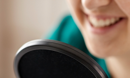 woman speaking into microphone