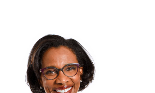 profile shot of a woman in a white coat