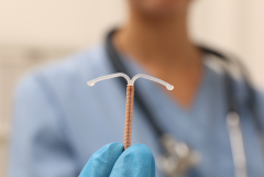 Doctor holding intrauterine device