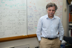man standing in front of a whiteboard